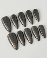 Black Cat-eye press-on nails in medium stiletto shape — black cat eye