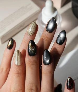 Black Lacquer press on nails with real gold foil in deep amber red and glossy black, gold studs and fine gold pinstripes on cream - image 2