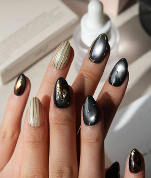 Black Lacquer press on nails with real gold foil in deep amber red and glossy black, gold studs and fine gold pinstripes on cream - image 2