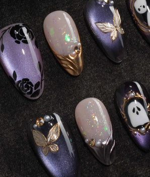 Black Rose Ball press on nails with black roses, a gold butterfly, pearls and a ghost in a gold frame on lilac violet pearl cat eye - image 1