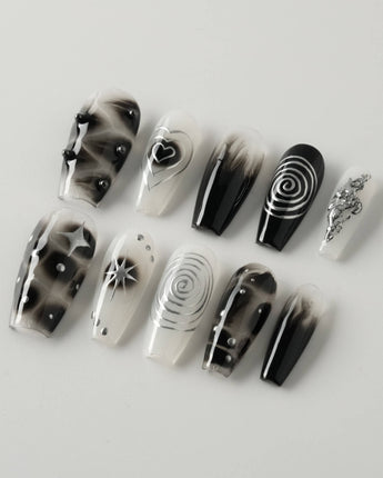 Black & Silver Void press-on nails in medium coffin shape — black aura swirl abstract nails