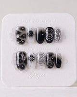 Black & Silver Void press-on nails in short oval shape — black aura swirl abstract nails