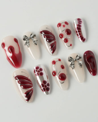 Silver Butterfly press-on nails in medium almond shape — Silver & Red Gothic, 3D Bows & Blood Drops.