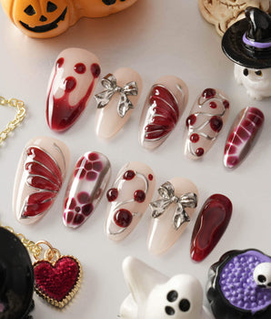 Silver Butterfly handmade press-on nails featuring Silver & Red Gothic, 3D Bows & Blood Drops.