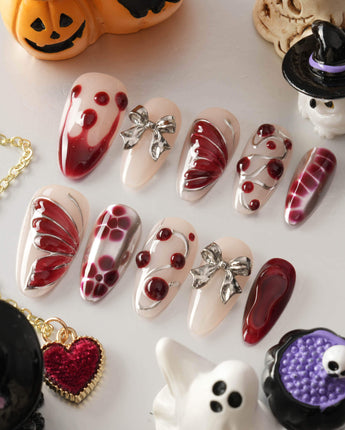 Silver Butterfly handmade press-on nails featuring Silver & Red Gothic, 3D Bows & Blood Drops.