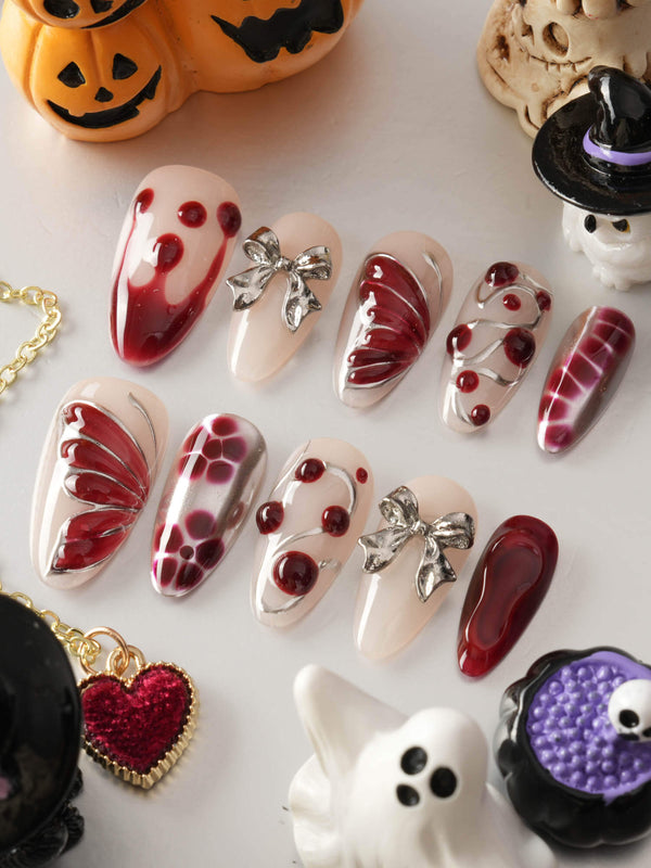 Silver Butterfly handmade press-on nails featuring Silver & Red Gothic, 3D Bows & Blood Drops.