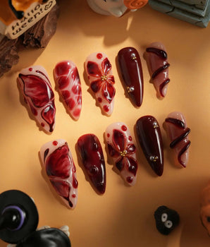 Bloody Kiss handmade press-on nails featuring deep red marble nude base 3D flower chrome beads sculpted gel drip design