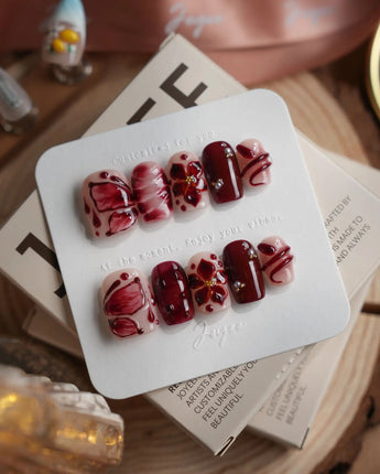 Bloody Kiss nails in extra short square — deep red marble nude