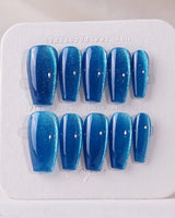 Blue Sky Cat-eye press-on nails in medium coffin shape — Peacock Blue cat eye 