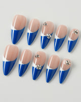 Creative blue French nail designs with unique patterns and accents.