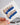 Blue French tip coffin nails with a trendy and modern shape.