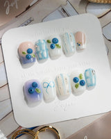 Blue Grid handmade blue summer nails with 3D blueberries and subtle plaid sections