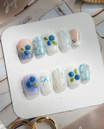 Blue Grid handmade blue summer nails with 3D blueberries and subtle plaid sections