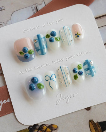 Blue Grid press-on nail set with raised berry details and breezy shirt-inspired plaid