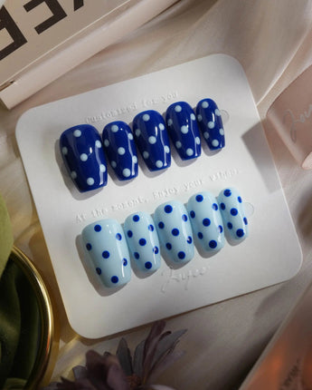 Blue Swirl press-on nails in short coffin shape — navy blue & light blue Polka Dots