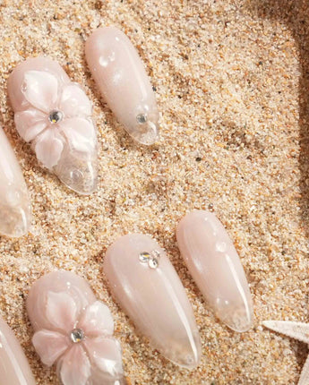 Blush Melt glossy nude pink nail set with cat-eye glow and floral gel texture