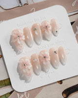 Blush Melt medium almond nail art with translucent flowers and blush shimmer