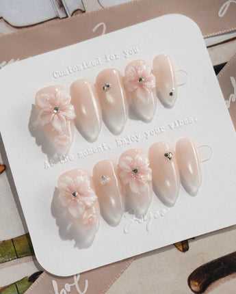Blush Melt medium almond nail art with translucent flowers and blush shimmer