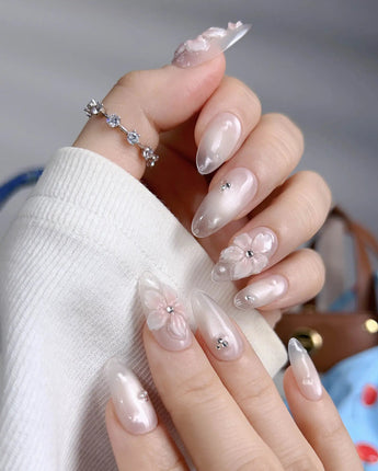 Blush Melt pink slush inspired press-on nails with clear petals and sparkle
