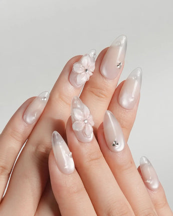 Blush Melt close-up of 3D translucent flowers on aurora nude press-on nails