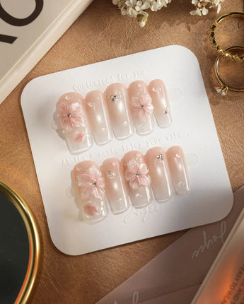 Blush Melt handmade press-on nails with icy petals, shimmer and glossy drops