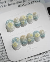 Bora Bora Blue dreamy beach nails with curved light flow and glossy blue shimmer