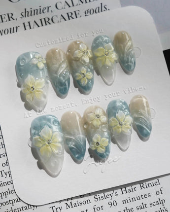Bora Bora Blue handmade press-ons with icy blue water shine and 3D plumeria blossoms