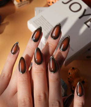 Bourbon press on nails in warm brown glossy jelly with a hand-drawn gold chrome outline - image 2