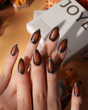 Bourbon press on nails in warm brown glossy jelly with a hand-drawn gold chrome outline - image 2