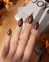 Bourbon press on nails in warm brown glossy jelly with a hand-drawn gold chrome outline - image 3