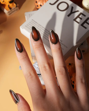 Bourbon press on nails in warm brown glossy jelly with a hand-drawn gold chrome outline - image 4