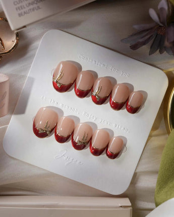 Bow French extra short oval press-on nails with red chrome tips and gold bow accents