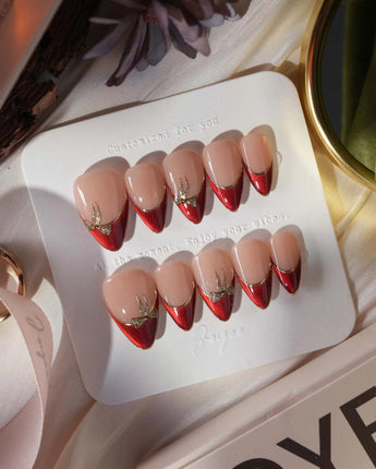 Bow French short stiletto press-on nails with red chrome tips and gold bow accents