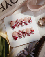 Broadway Rouge nails in extra short almond — Festive Red & White