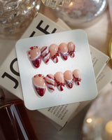 Broadway Rouge nails in short almond — Festive Red & White