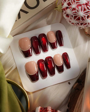 Brocade press-on nails with burgundy baroque texture, rose details and silver chain accents