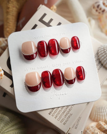 Brocade extra short oval press-on nails with deep red and burgundy fall nail art