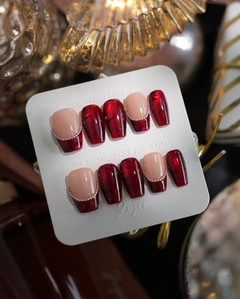 Brocade short coffin press-on nails with vintage red baroque texture and silver chain accents