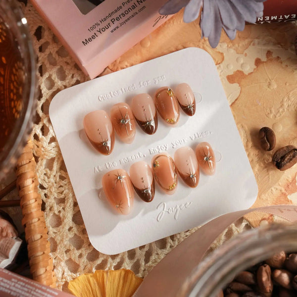 brown French tip press-on nails with stars