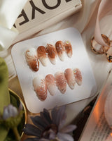 Brown & Khaki press-on nails in L medium almond with earthy brown and khaki fall tones