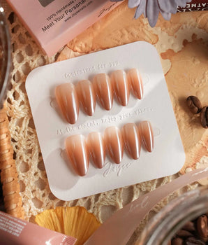 Caramel Chrome nail set with warm nude brown gradient and reflective caramel gel finish