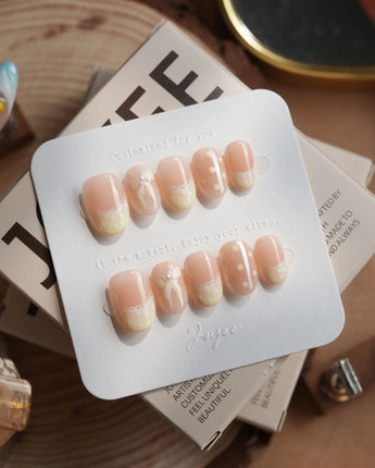 Butter Bow nails in extra short oval — Creamy Soft Yellow, Lace