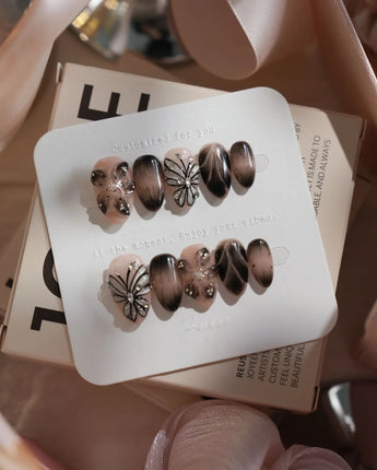 Butterfly Effect nails in extra short almond — Neutral Nude & Black,