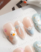 Call Duck Tutu short almond press-on nails with 3D ducklings and blush blue base