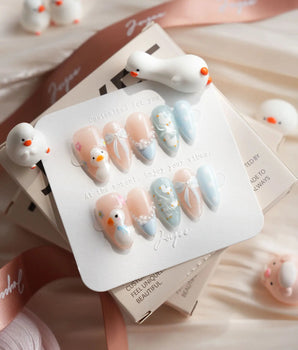 Call Duck Tutu press-on nail set with tiny duck charms, bows and pearl strings