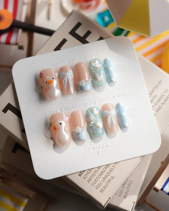 Call Duck Tutu short coffin press-on nails with blush blue duckling design