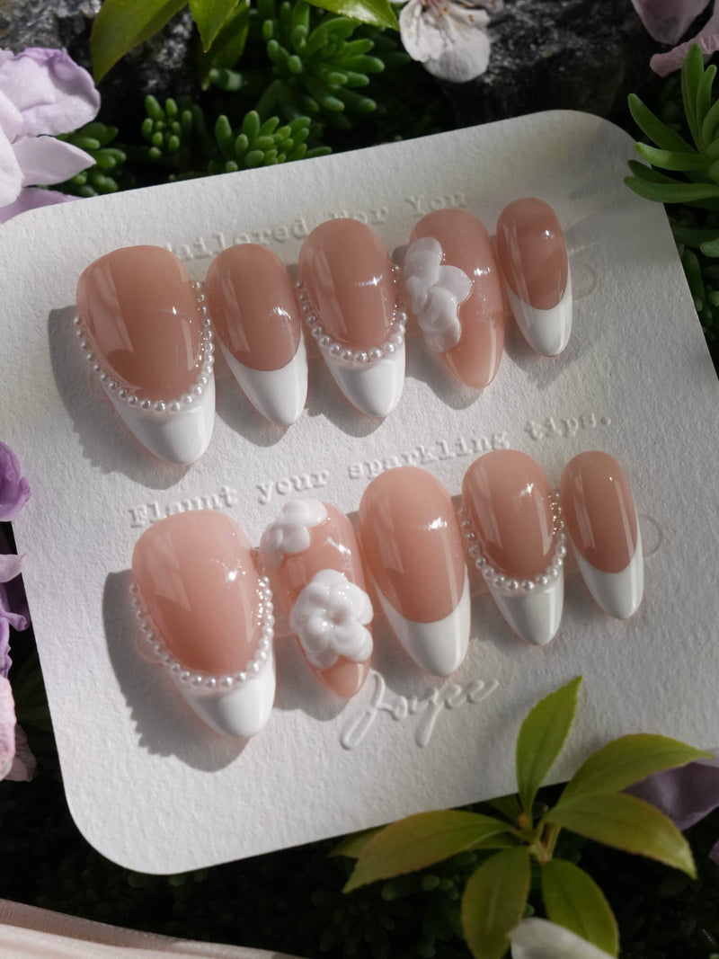 Camellia-Classy AF handmade press-on nails with nude pink base, white French tips, and 3D sculpted camellia flowers
