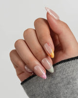 Candy Dot custom-size short almond nails with playful pastel polka dot French tips