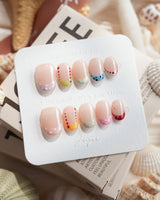 Candy Dot extra short oval press-on nails with pastel French tips and dotted gel art