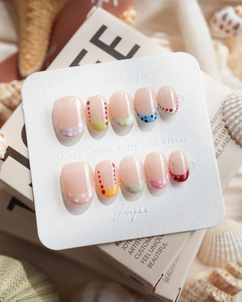 Candy Dot extra short oval press-on nails with pastel French tips and dotted gel art